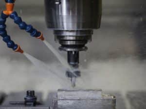 Pennine Metalworking Fluid in action in machine.